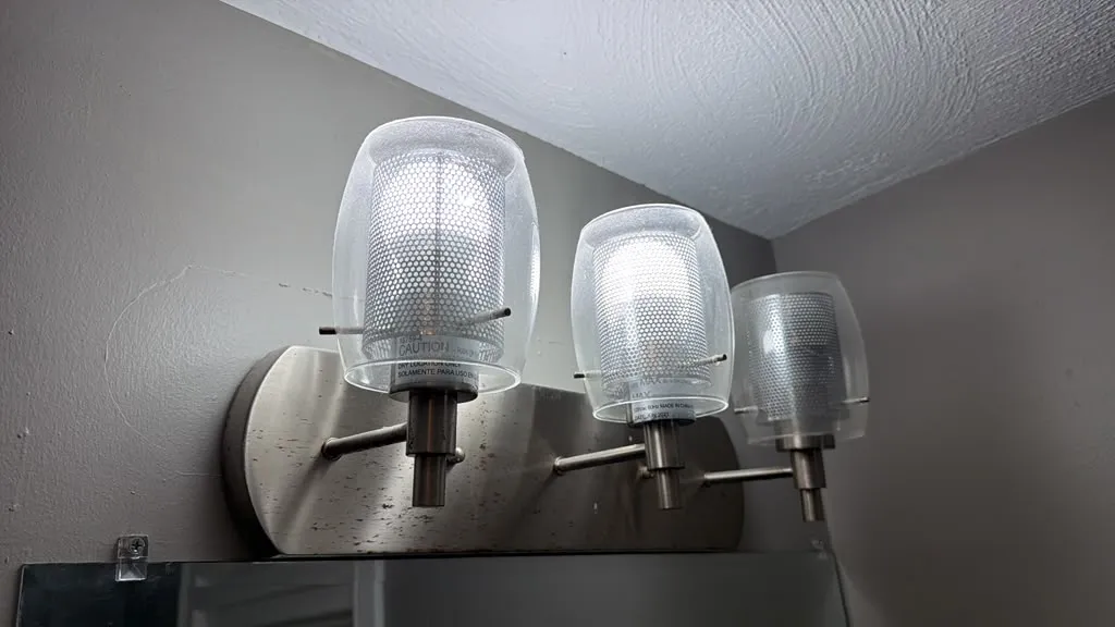 Glass light fixtures cleaned and shining