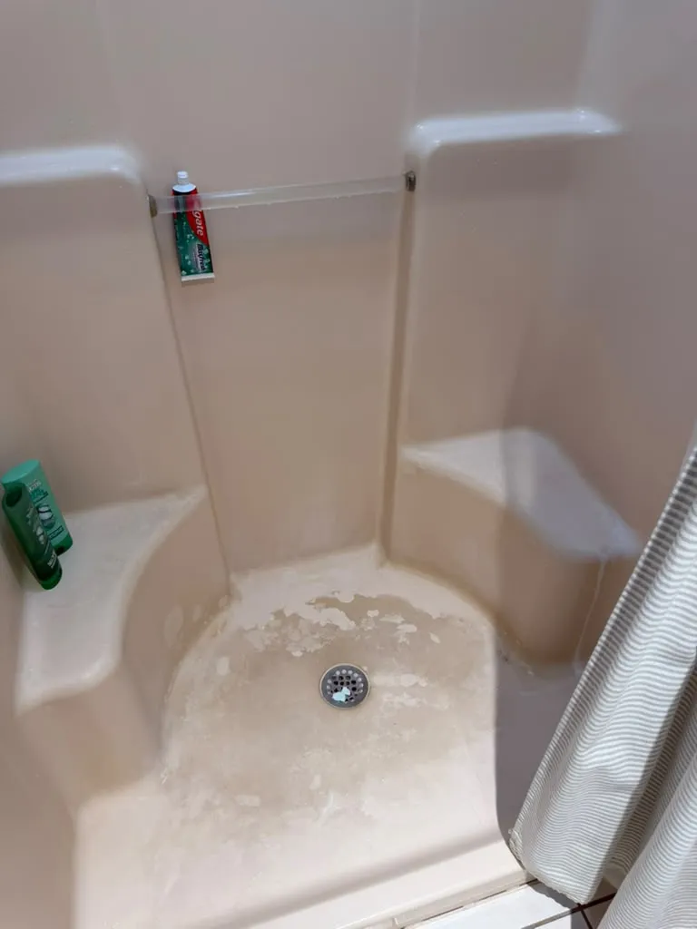 Shower stall before cleaning
